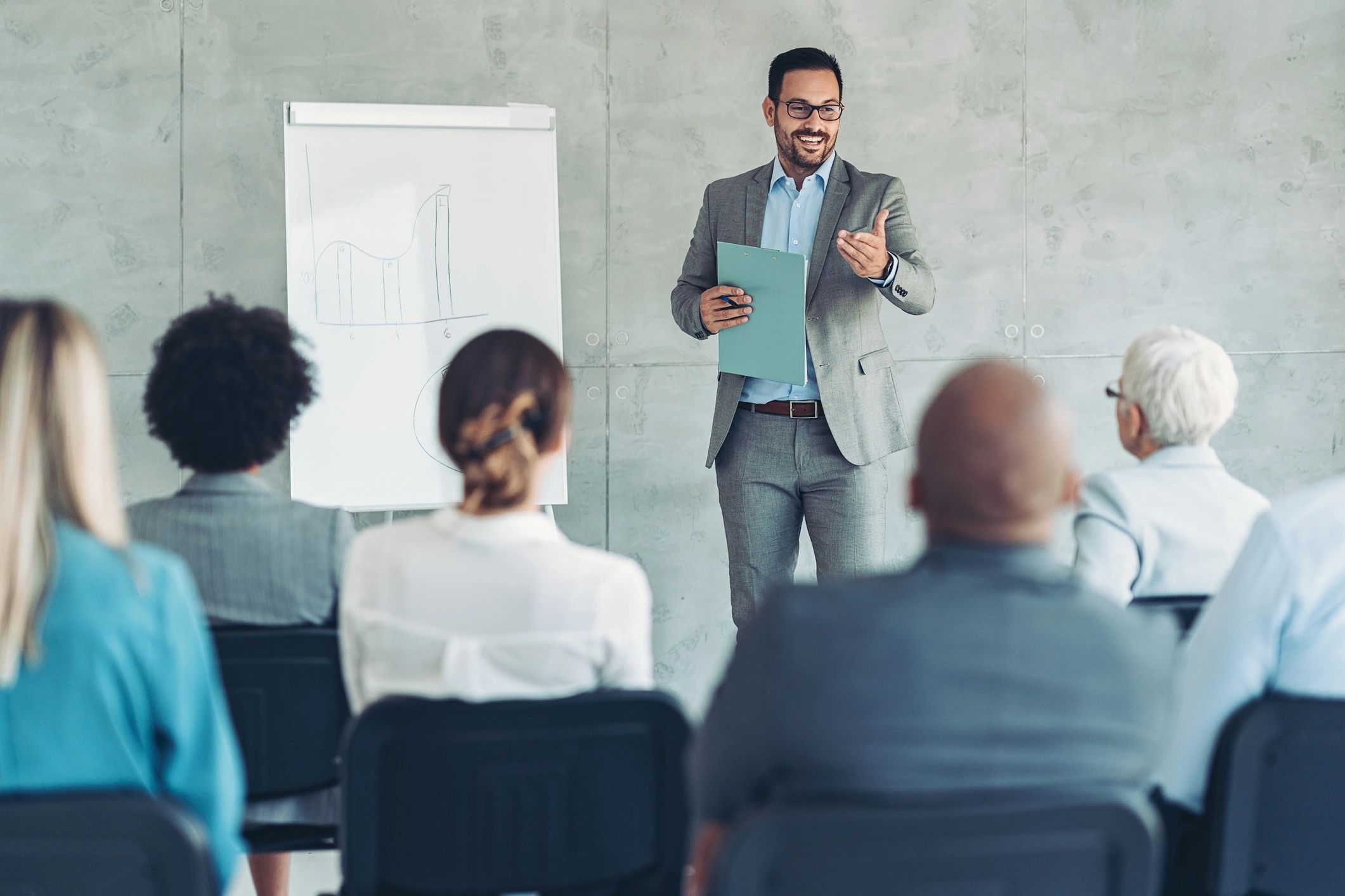 Business conference audience listening to a speaker