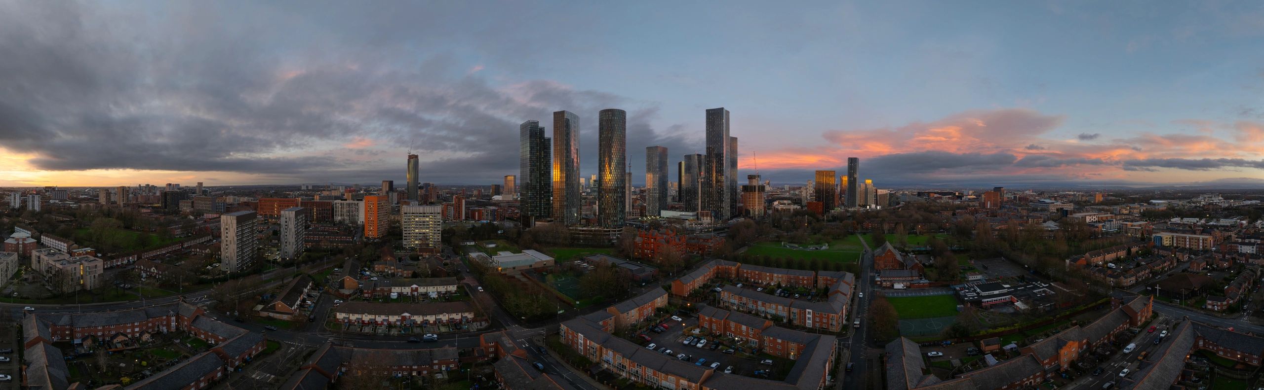 Panoramic city skyline at sunset representing growth and momentum