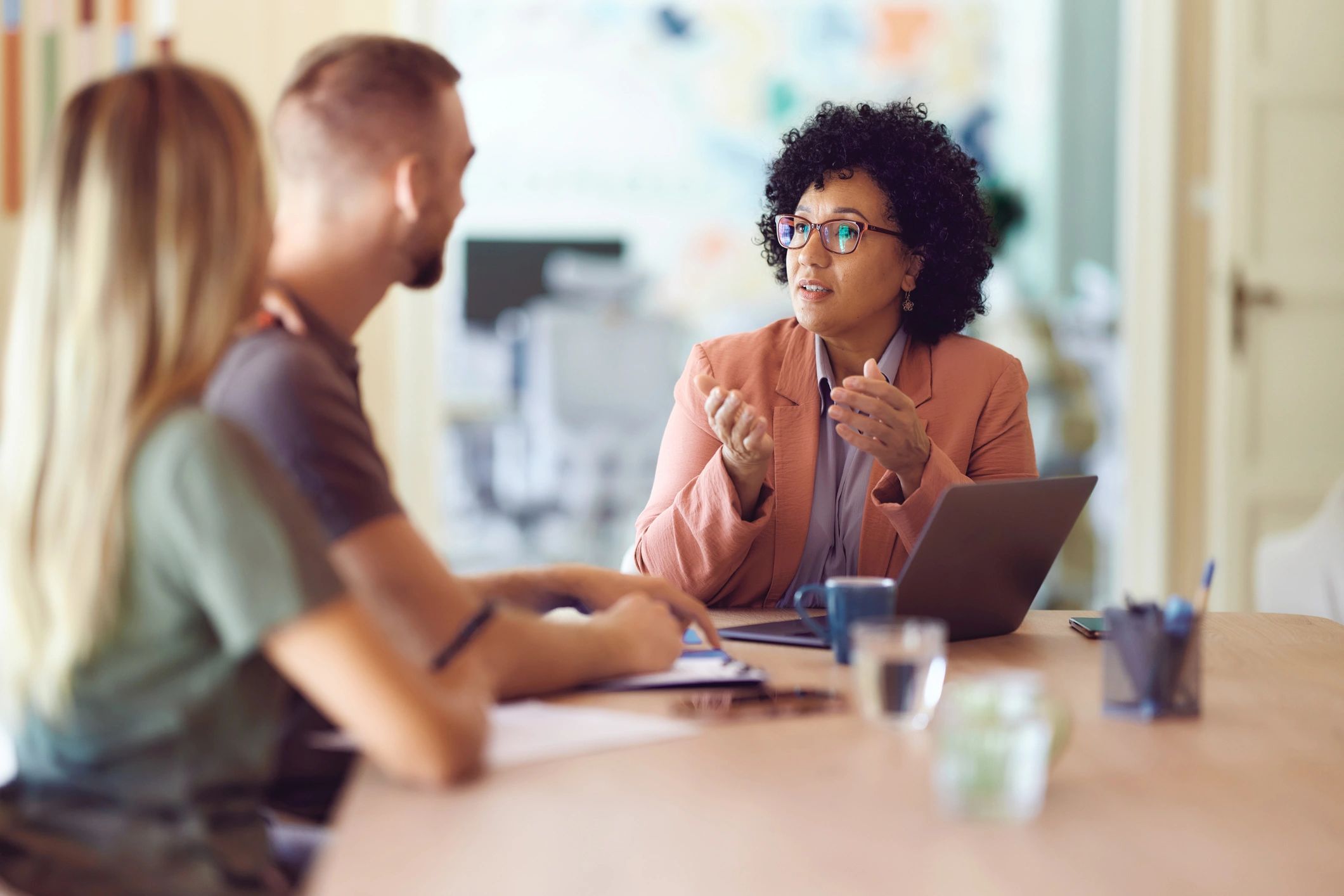 Consultant meeting with clients in an office
